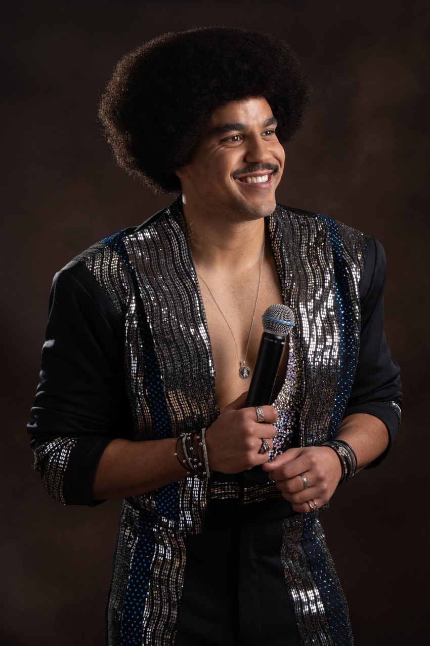 Jack is on set holding the mic