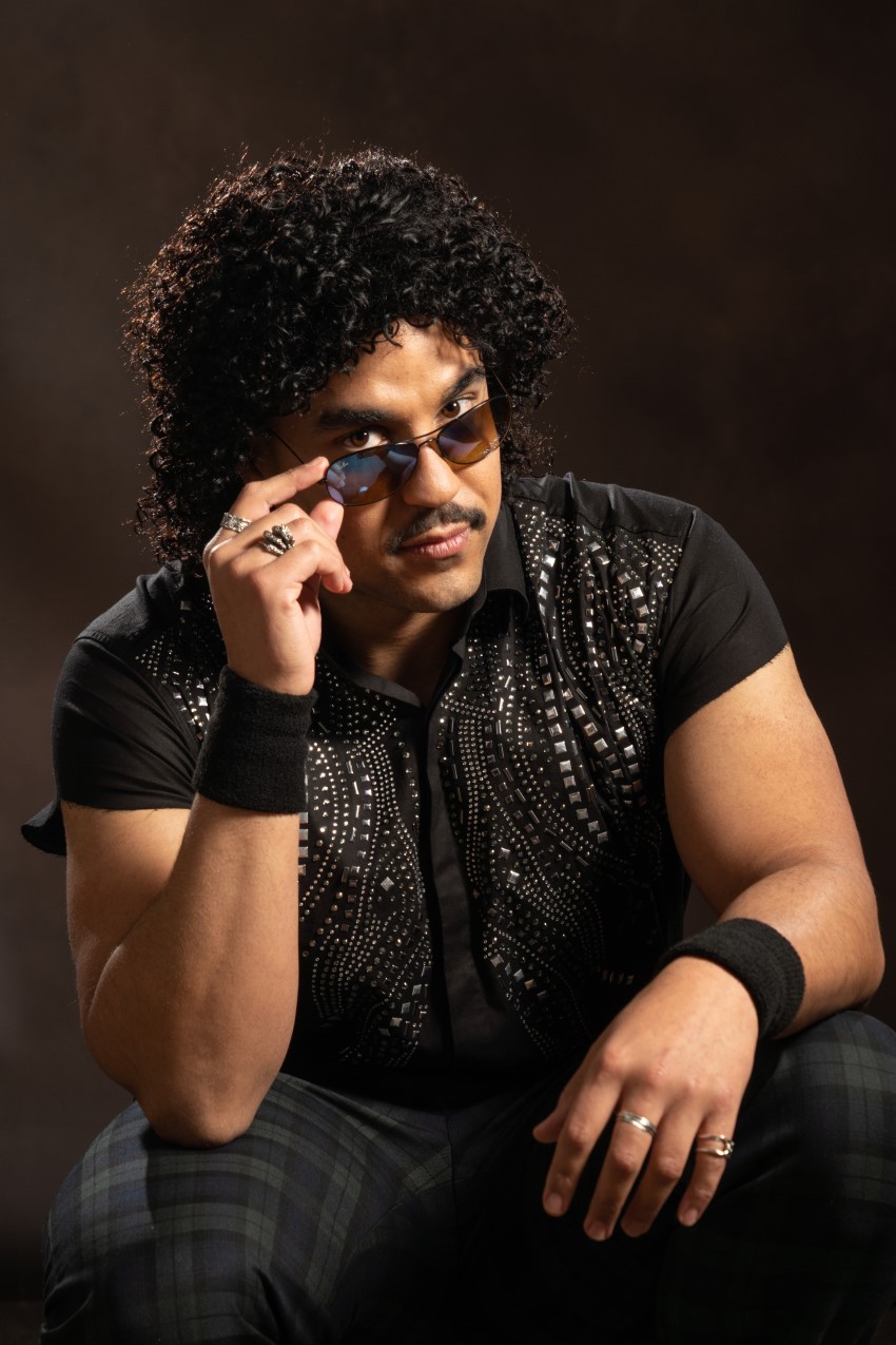 Tipping his shades forward as Lionel Richie